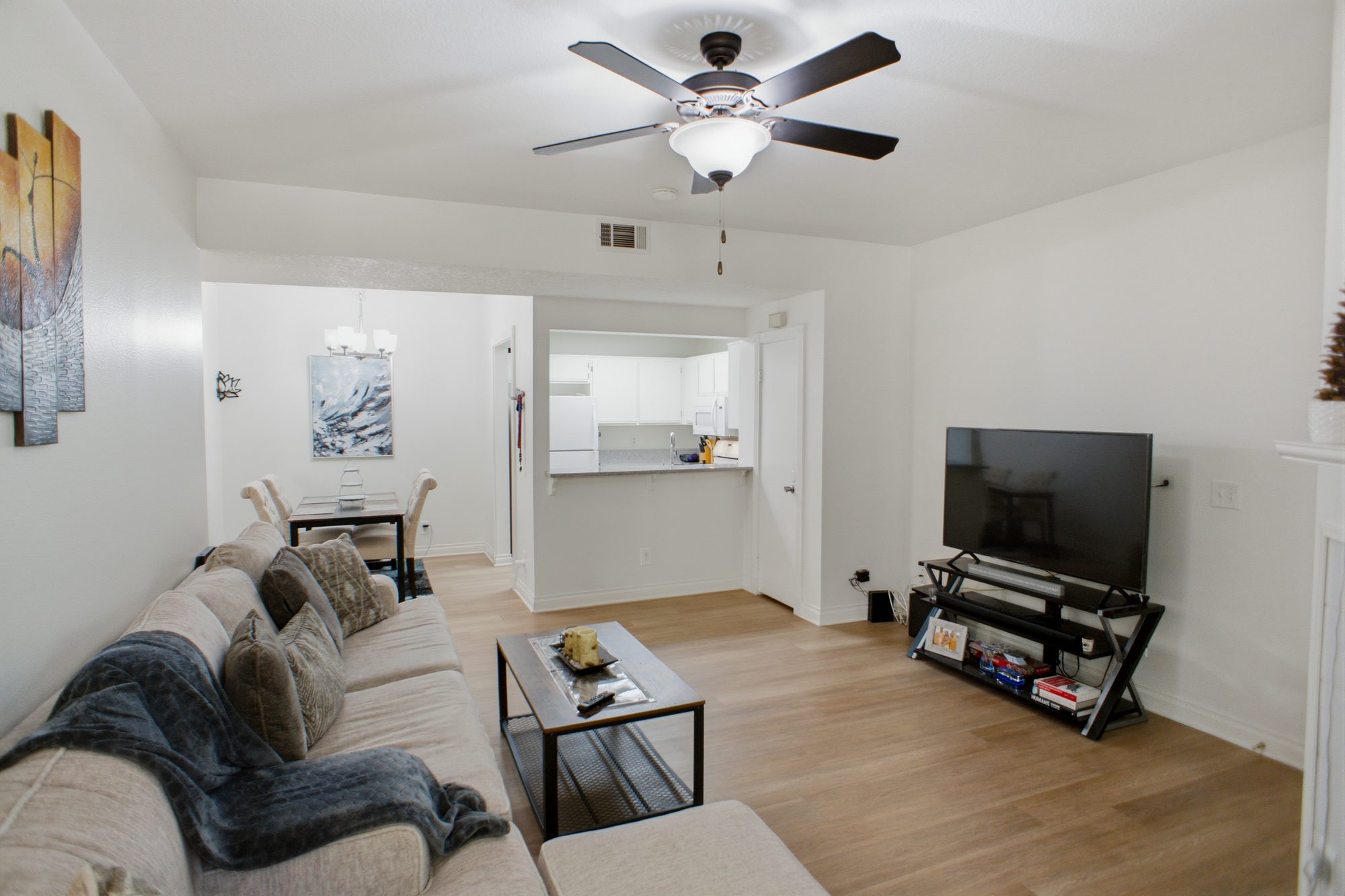 Open concept living area looking toward the dining space and kitchen