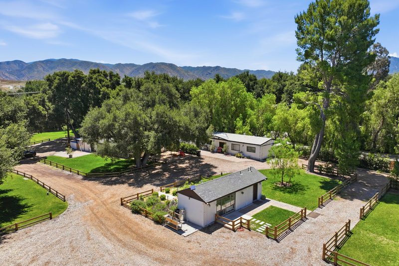 Aerial, main home and drive