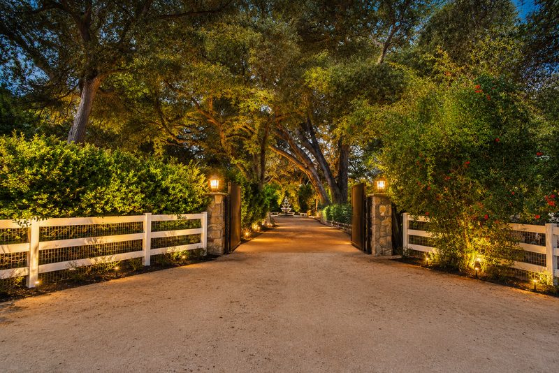 The gated entry at dusk